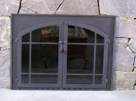 The Square to Arch Window-pane, all black finish,(straight top window- pane bar) with heavy hammer molding, twin doors, smoked glass installed on stone.